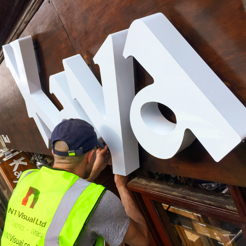 Kayal is spelt out in 3D lettering in a warm brown. These 3D letters have been mounted above the retaurant entrance with a natural wood behind.