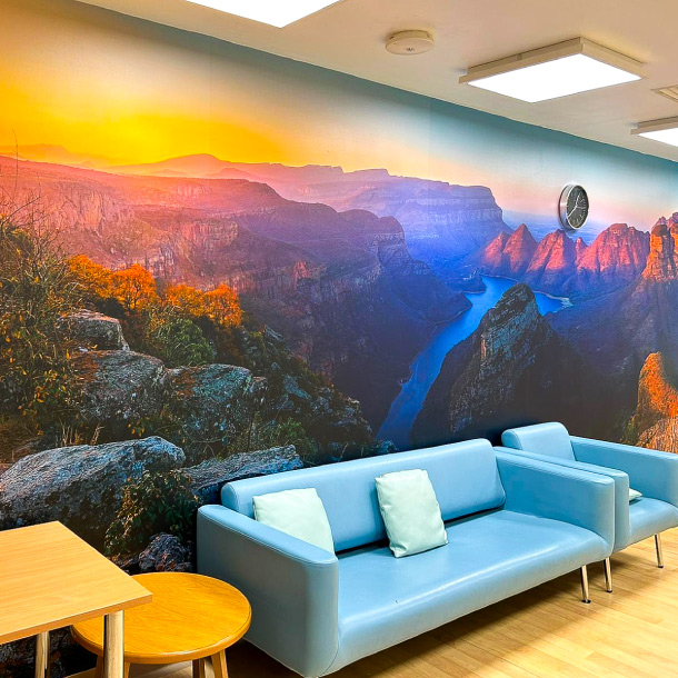 QMC Waiting area with a relaxing sunset wall wrap