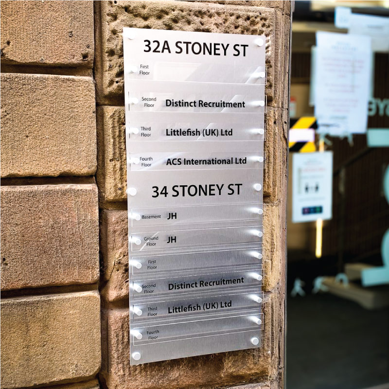 External tenants sign using clear acrylic panels with Black vinyl lettering