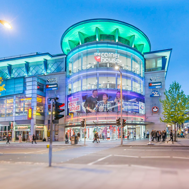 Nottingham Cornerhouse with a large format print covering most of the first floor windows. The print shows three capital FM presents laughing and advertises capital FM.