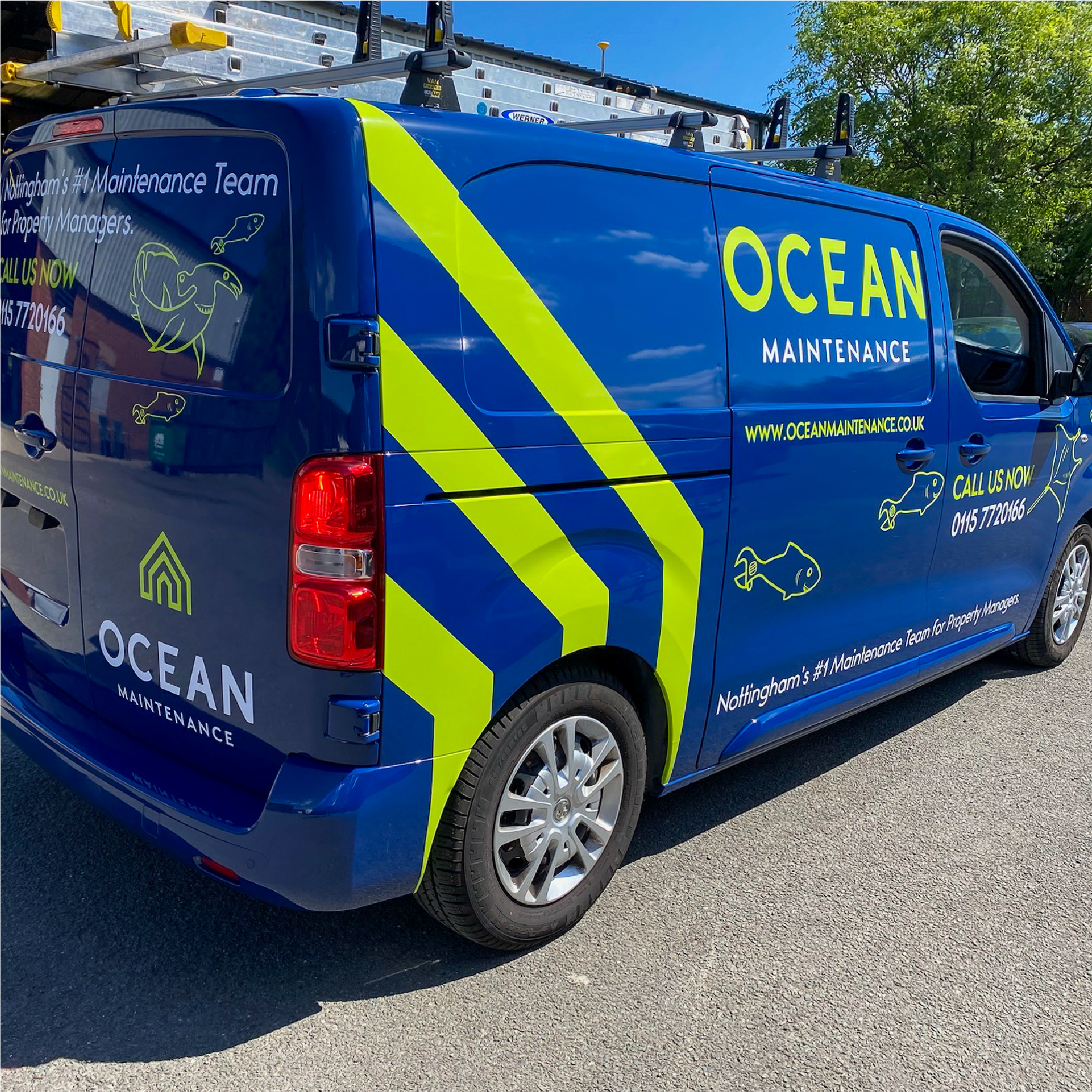 A small van that has been wrapped blue with neon green graphics. The graphics are the company logo, service and contact info and sea creatures drawn as maintenance tools e.g. hammerhead shark with a hammer for a head.